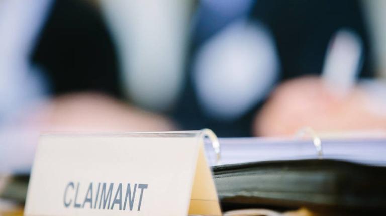 court proceedings; close up of 'Claimant' label