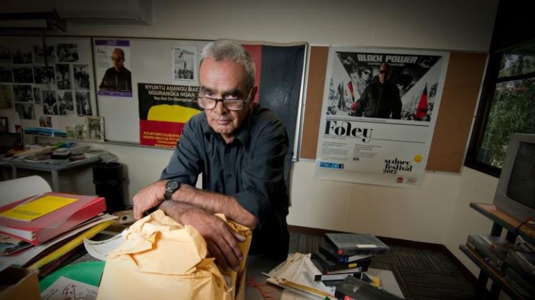 Professor Gary Foley surrounded by objects from Aboriginal History Archive Professor Gary Foley surrounded by objects from Aboriginal History Archive