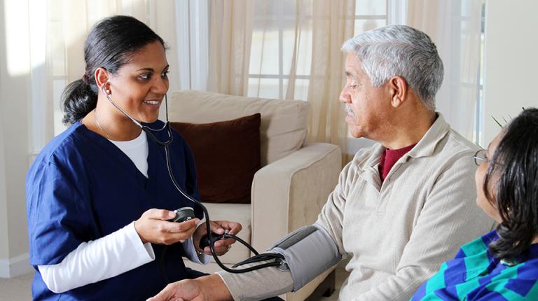 A healthcare worker with a patient.