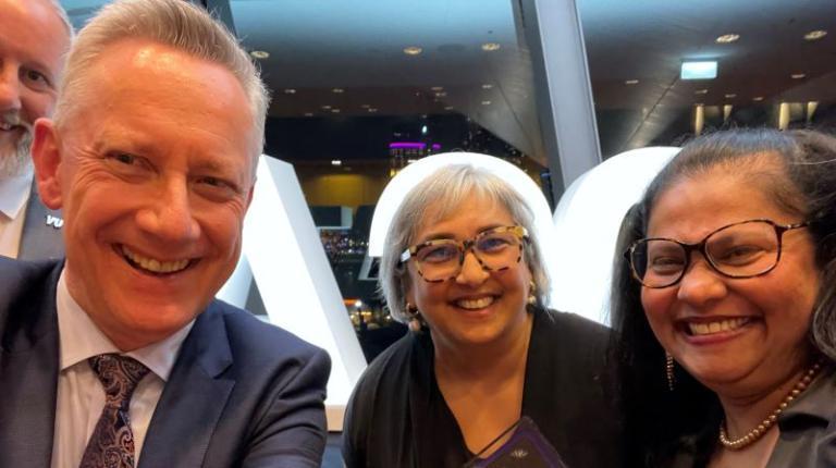 VU Vice-Chancellor Adam Shoemaker receives award with VU Polytechnic's Maria Juj and Candida Menzes Recipients of award from VU and VUP
