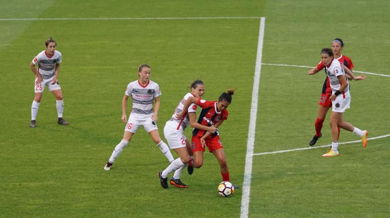 Women playing soccer