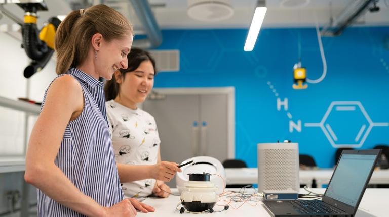 Two women engineers in a lab