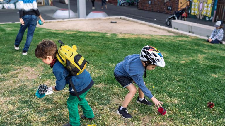 Children playing in Maddern Square during an event, photographed by Shuttermain