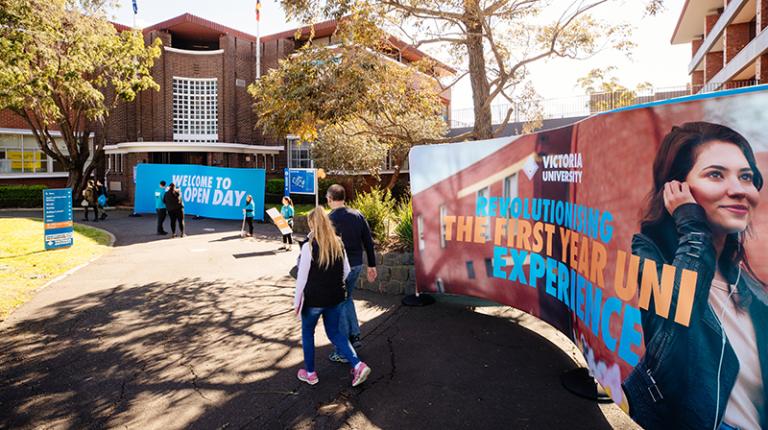 VU, challenging a 900-year-old university system Students at Footscray Park Campus, with First Year marketing banner