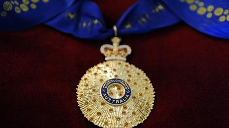 A close-up of a Queen's Birthday medal