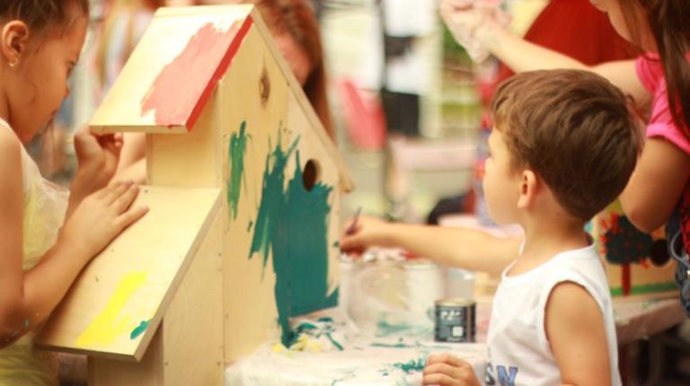 Child painting at preschool