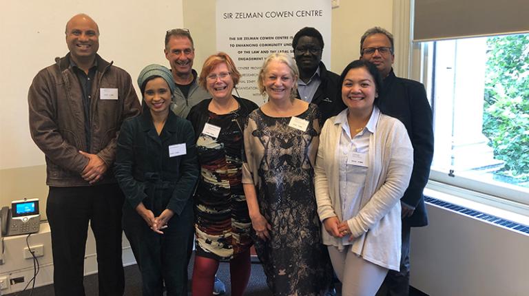 Ripple Effect program workshop held in February 2020. Photo of the program participants standing in front of a banner.