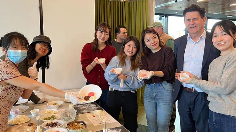 VBCI Director Professor Colin Clark (second from right) invited everyone to experience making mooncakes. Professor Colin Clark (second from right) with participants at VBCI's Mid-Autumn Festival making mooncakes.