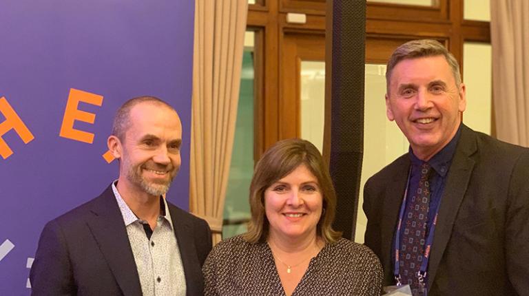 Director Capability & Culture, Kym Bakaric, accepts the 2019 Australian Higher Education Industrial Association (AHEIA)/Voice Project Award from the Director of Voice Project, Dr Peter Langford (left) and Executive Director AHEIA, Stuart Andrews