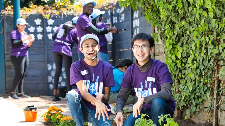  VU students planting a garden at an aged-care facility for V4U Day
