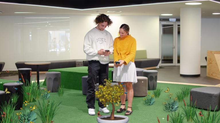 VU Explore up for prestigious technology award Two people using the VU App to experience augmented reality.