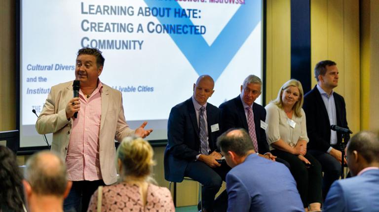 Forum brings community together to explore countering hate Speaker at forum on extremism