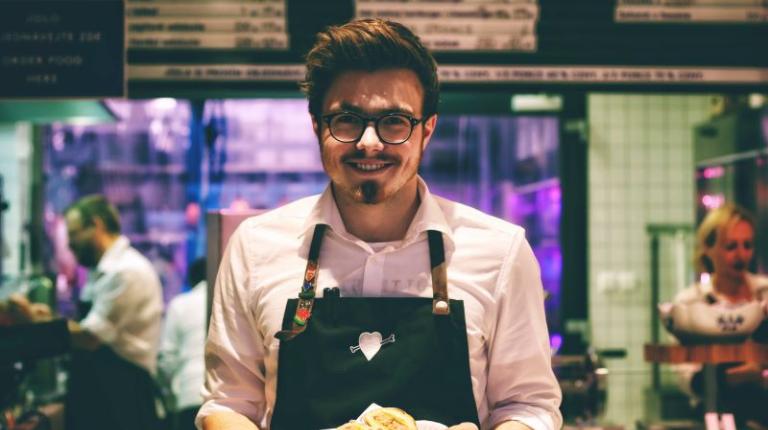 Visitor economy is reopening quickly and set for strong future growth Waiter carrying food