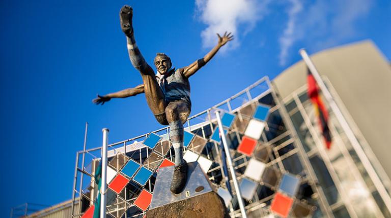 A statue of a bulldogs former player outside of Whitten Oval in Footscray, home of the Western Bulldogs.