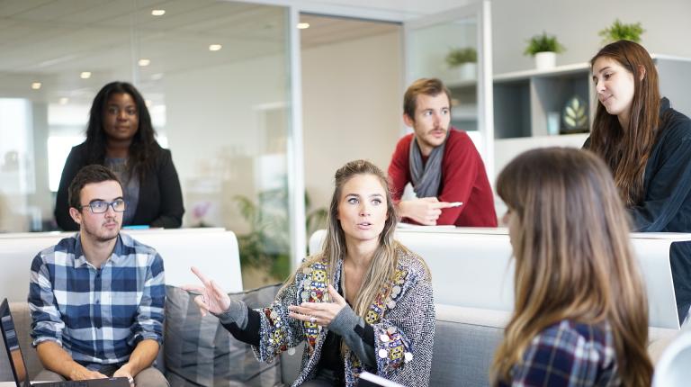 Diverse group of young men and women in a workplace setting