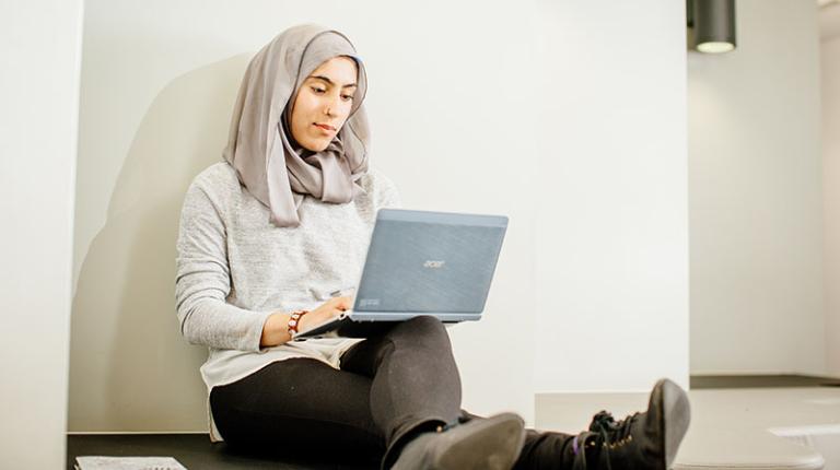 Student working and studying on a laptop