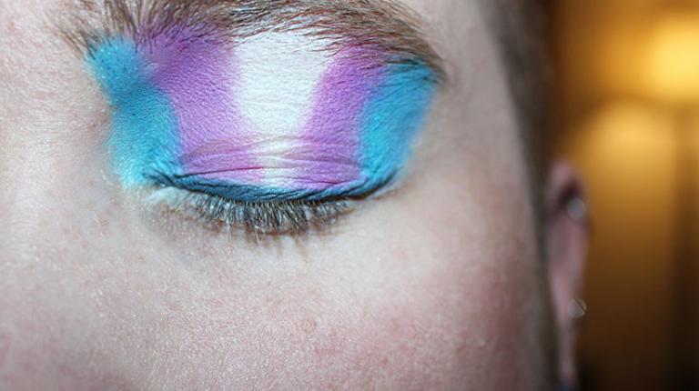  People with the colours of the transgender flag on their eyelid.