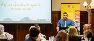  Mahde Hallab making a speech as part of the Aspire program.