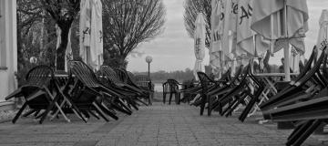  Black and white photo of empty outdoor cafe