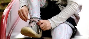  Young-girl-tying-shoe