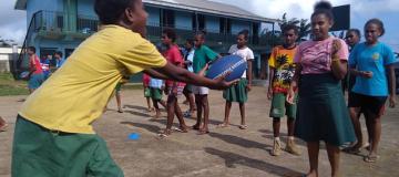  girls passing the footy in Vanuatu
