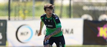 Josh risdon running towards a ball